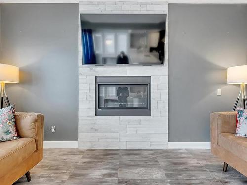 3578 Cherry Landing, Edmonton, AB - Indoor Photo Showing Living Room With Fireplace