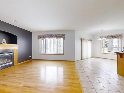 3516 29 Street, Edmonton, AB - Indoor Photo Showing Living Room With Fireplace