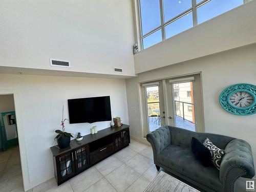 406 1350 Windermere Way, Edmonton, AB - Indoor Photo Showing Living Room