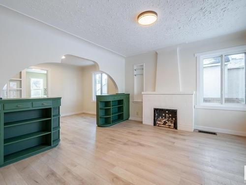 10819 92 Street, Edmonton, AB - Indoor Photo Showing Living Room With Fireplace