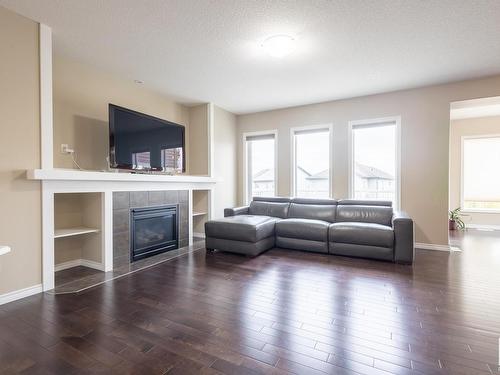 5932 12 Avenue, Edmonton, AB - Indoor Photo Showing Living Room With Fireplace