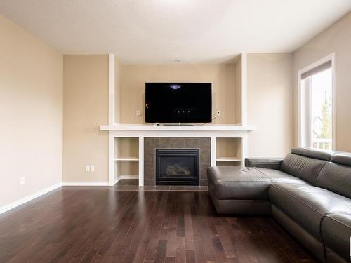 5932 12 Avenue, Edmonton, AB - Indoor Photo Showing Living Room With Fireplace