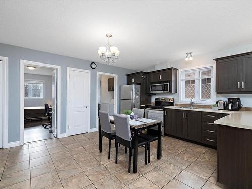 7 10103 101 Avenue, Morinville, AB - Indoor Photo Showing Kitchen With Double Sink