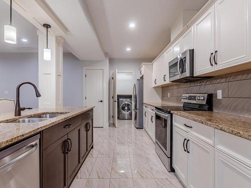 3036 58 Avenue Ne, Rural Leduc County, AB - Indoor Photo Showing Kitchen With Stainless Steel Kitchen With Double Sink