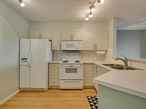 414 11716 100 Avenue, Edmonton, AB - Indoor Photo Showing Kitchen With Double Sink