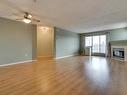 414 11716 100 Avenue, Edmonton, AB  - Indoor Photo Showing Living Room With Fireplace 