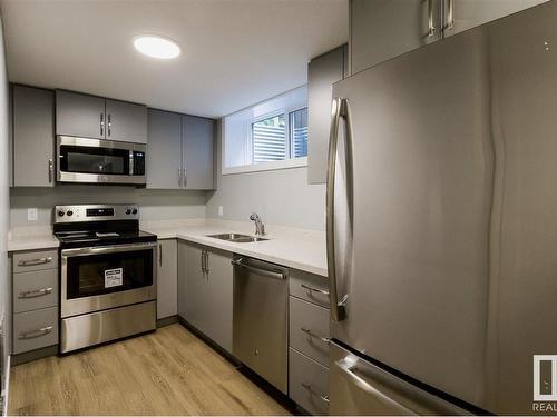 9511 70 Avenue, Edmonton, AB - Indoor Photo Showing Kitchen With Double Sink