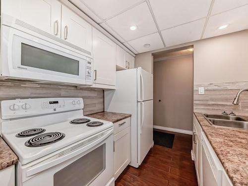 404 11007 83 Avenue, Edmonton, AB - Indoor Photo Showing Kitchen With Double Sink