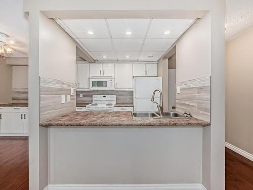 404 11007 83 Avenue, Edmonton, AB - Indoor Photo Showing Kitchen With Double Sink