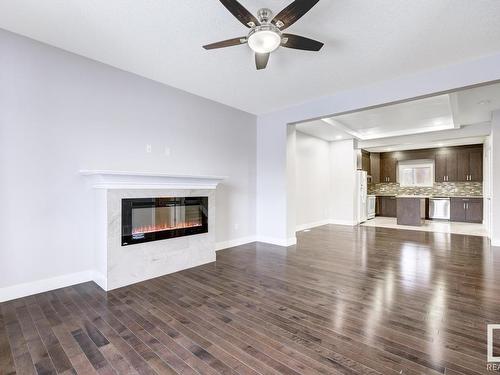 985 Mcconachie Boulevard, Edmonton, AB - Indoor Photo Showing Living Room With Fireplace