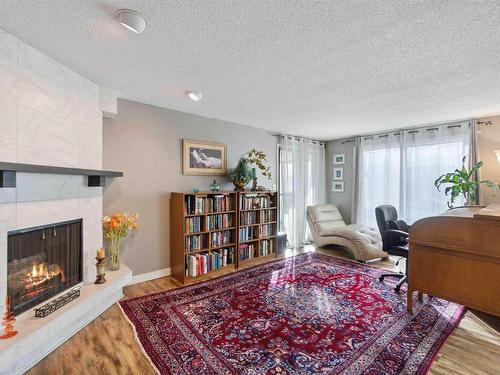 305 8707 107 Street, Edmonton, AB - Indoor Photo Showing Living Room With Fireplace