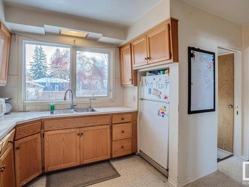 8739 Strathearn Crescent, Edmonton, AB - Indoor Photo Showing Kitchen With Double Sink