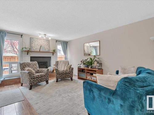 3623 30 Avenue, Edmonton, AB - Indoor Photo Showing Living Room With Fireplace