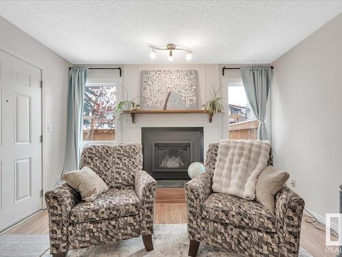 3623 30 Avenue, Edmonton, AB - Indoor Photo Showing Living Room With Fireplace