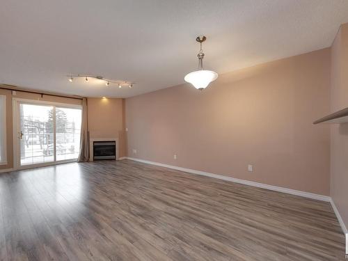 202 12110 106 Avenue, Edmonton, AB - Indoor Photo Showing Living Room With Fireplace