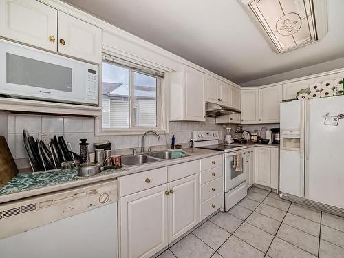 4126 33A Avenue, Edmonton, AB - Indoor Photo Showing Kitchen With Double Sink