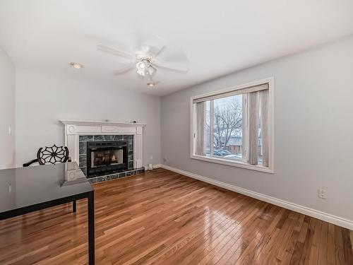 4126 33A Avenue, Edmonton, AB - Indoor Photo Showing Living Room With Fireplace