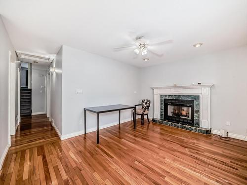 4126 33A Avenue, Edmonton, AB - Indoor Photo Showing Living Room With Fireplace