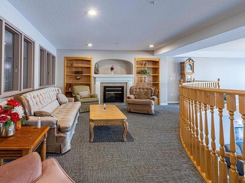 336 2741 55 Street, Edmonton, AB - Indoor Photo Showing Other Room With Fireplace