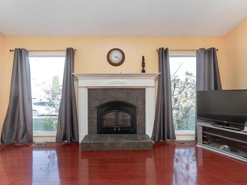 4346 38 Street, Edmonton, AB - Indoor Photo Showing Living Room With Fireplace