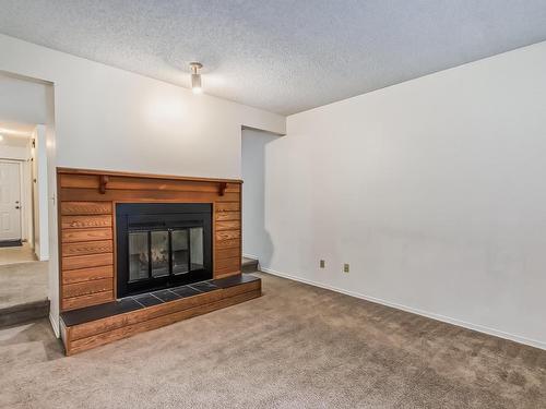 16 7604 29 Avenue, Edmonton, AB - Indoor Photo Showing Living Room With Fireplace