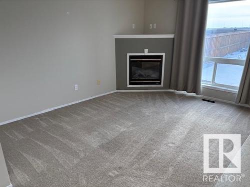 9081 Scott Crescent, Edmonton, AB - Indoor Photo Showing Living Room With Fireplace