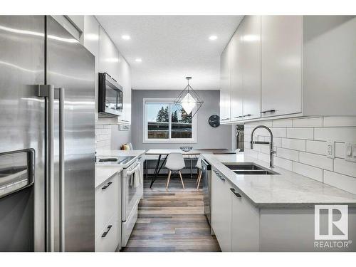 108 5125 Riverbend Road, Edmonton, AB - Indoor Photo Showing Kitchen With Double Sink With Upgraded Kitchen