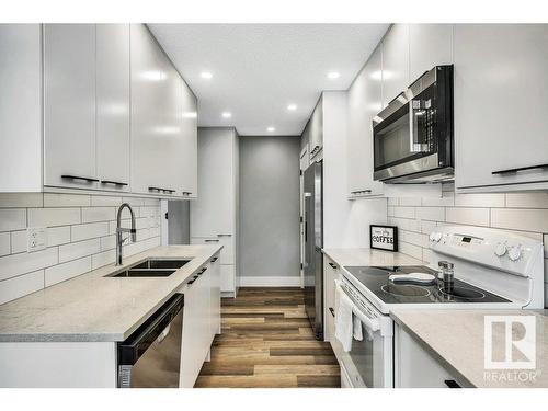 108 5125 Riverbend Road, Edmonton, AB - Indoor Photo Showing Kitchen With Double Sink With Upgraded Kitchen