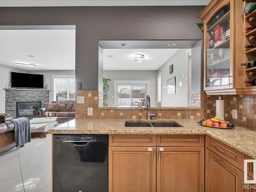 10824 179 Avenue, Edmonton, AB - Indoor Photo Showing Kitchen With Fireplace With Double Sink