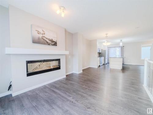 37 4050 Savaryn Drive, Edmonton, AB - Indoor Photo Showing Living Room With Fireplace