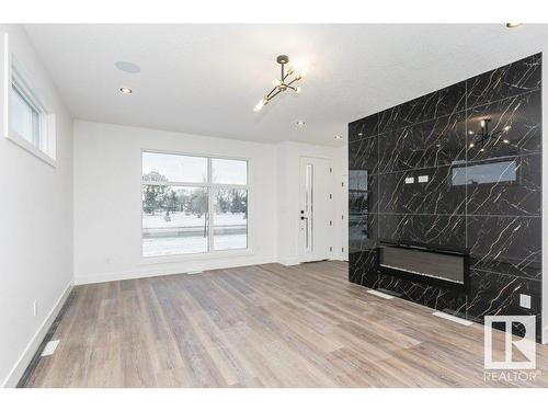 7607 98 Avenue, Edmonton, AB - Indoor Photo Showing Other Room With Fireplace