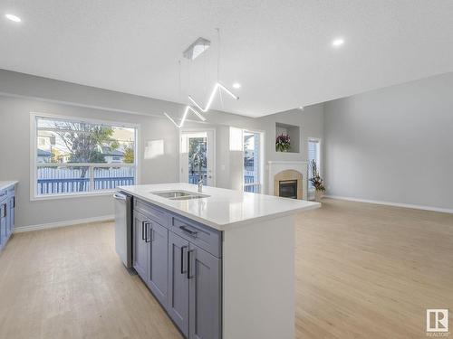 8 Foxhaven Crescent, Sherwood Park, AB - Indoor Photo Showing Kitchen With Fireplace With Double Sink