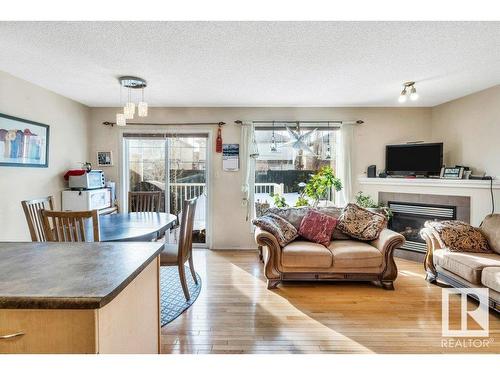 29 12104 16 Avenue, Edmonton, AB - Indoor Photo Showing Living Room With Fireplace