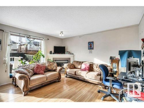 29 12104 16 Avenue, Edmonton, AB - Indoor Photo Showing Living Room With Fireplace