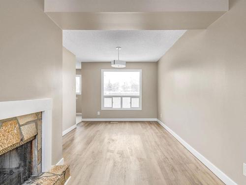 5 1651 46 Street, Edmonton, AB - Indoor Photo Showing Other Room With Fireplace