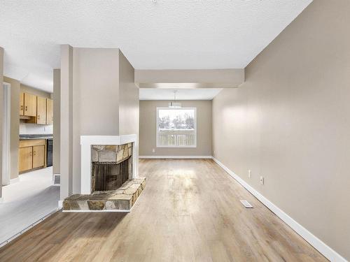 5 1651 46 Street, Edmonton, AB - Indoor Photo Showing Other Room With Fireplace