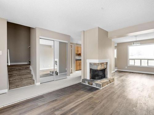 5 1651 46 Street, Edmonton, AB - Indoor Photo Showing Living Room With Fireplace