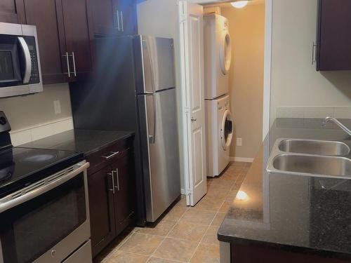 413 5804 Mullen Place, Edmonton, AB - Indoor Photo Showing Kitchen With Double Sink