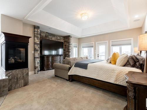 3104 Watson Green, Edmonton, AB - Indoor Photo Showing Bedroom With Fireplace