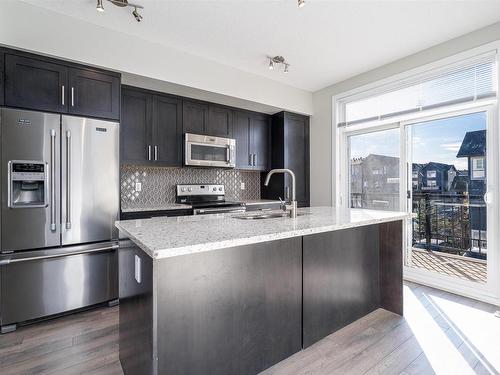 38 2560 Pegasus Boulevard Nw, Edmonton, AB - Indoor Photo Showing Kitchen With Stainless Steel Kitchen With Upgraded Kitchen