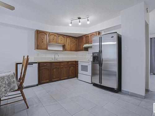 13844 24 Street, Edmonton, AB - Indoor Photo Showing Kitchen With Double Sink