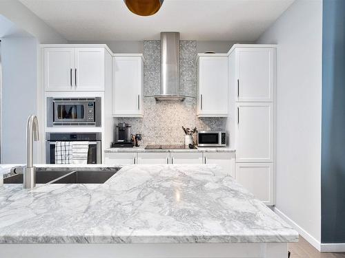 703 Secord Boulevard, Edmonton, AB - Indoor Photo Showing Kitchen With Double Sink With Upgraded Kitchen