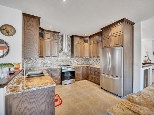 16 53407 Rge Road 30, Rural Parkland County, AB - Indoor Photo Showing Kitchen With Stainless Steel Kitchen With Double Sink With Upgraded Kitchen