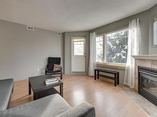 305 8909 100 Street, Edmonton, AB - Indoor Photo Showing Living Room With Fireplace