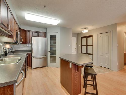 305 8909 100 Street, Edmonton, AB - Indoor Photo Showing Kitchen With Double Sink