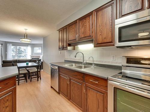 305 8909 100 Street, Edmonton, AB - Indoor Photo Showing Kitchen With Double Sink