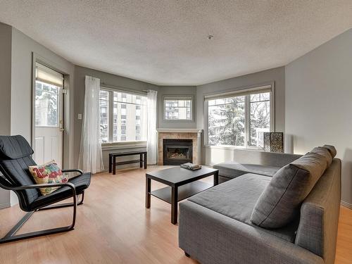 305 8909 100 Street, Edmonton, AB - Indoor Photo Showing Living Room With Fireplace