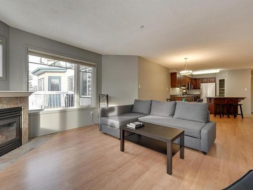 305 8909 100 Street, Edmonton, AB - Indoor Photo Showing Living Room With Fireplace