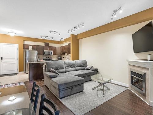 414 2035 Grantham Court, Edmonton, AB - Indoor Photo Showing Living Room With Fireplace