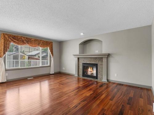 2923 24 Avenue, Edmonton, AB - Indoor Photo Showing Living Room With Fireplace